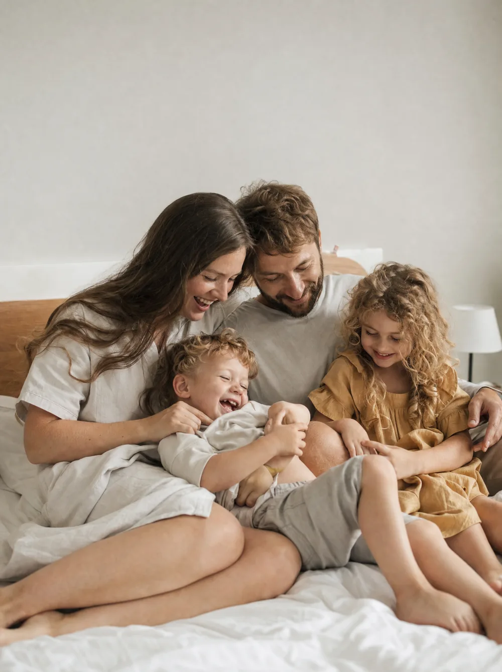 Candid family lifestyle moment, parents and kids together in muted natural tones